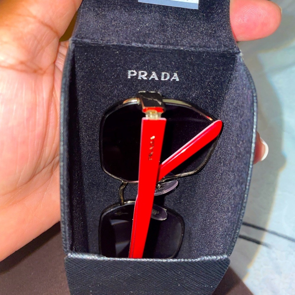 Prada sunglasses, red frame. Worn but gently